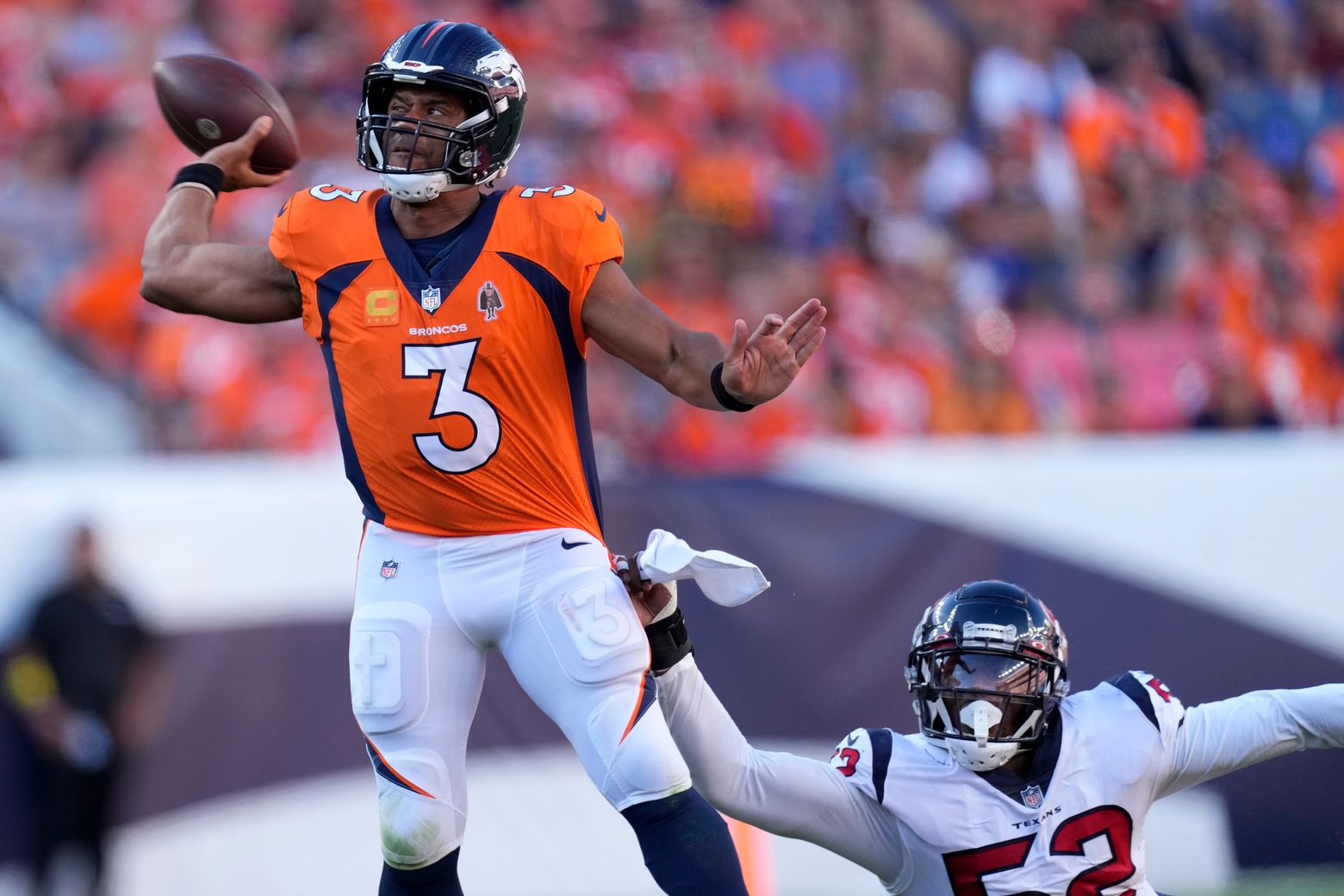 Russell Wilson leads sloppy Broncos past Texans in home opener