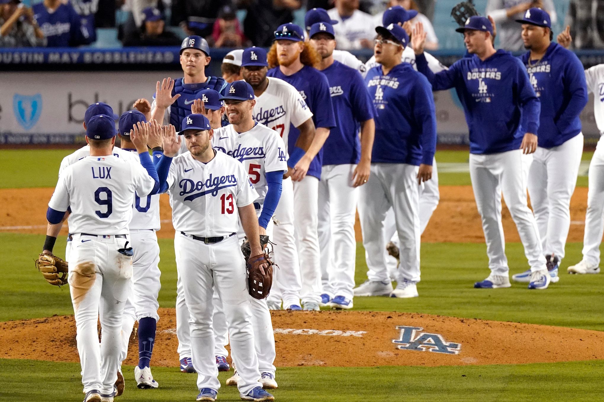 Los Angeles Dodgers Orel Hershiser, left, is congratulated by