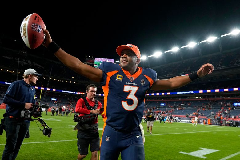 Broncos Wire - Russell Wilson in a Denver Broncos uniform 