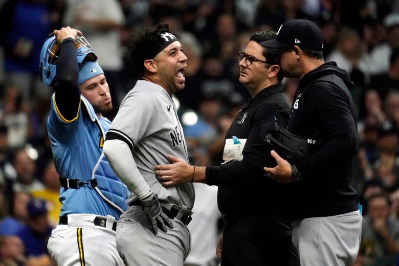 Marwin Gonzalez of the New York Yankees reacts after reaching