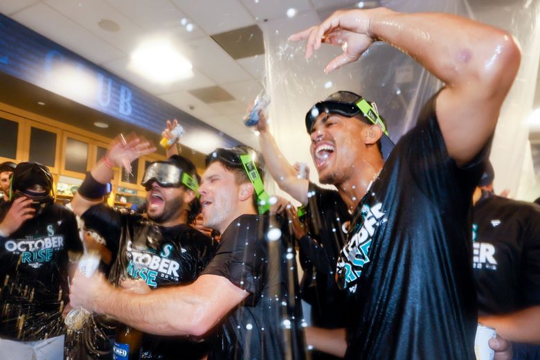 Official Seattle Mariners Julio Rodriguez celebrates with trident shirt