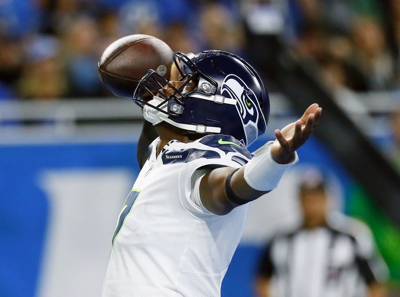 Seattle Seahawks quarterback Geno Smith reacts after his 8-yard touchdown run during the first half of an NFL football game against the Detroit Lions, Sunday, Oct. 2, 2022, in Detroit. (AP Photo/Duane Burleson) DTF120 DTF120 (Duane Burleson / The Associated Press)