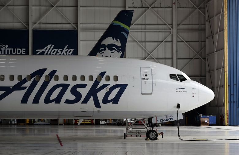 An Alaska Airlines 737 MAX 9 sits inside a hangar at Seattle-Tacoma International Airport in August. Travel statistics on the Department of Transportation website show Alaska had the top on-time performance among all U.S. airlines in June and July. (Ken Lambert / The Seattle Times)