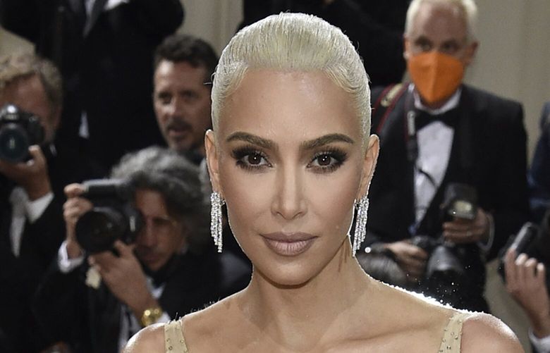 FILE – Kim Kardashian attends The Metropolitan Museum of Art’s Costume Institute benefit gala celebrating the opening of the “In America: An Anthology of Fashion” exhibition on Monday, May 2, 2022, in New York. Reality tv star and entrepreneur Kim Kardashian has agreed to settle charges brought by the Securities and Exchange Commission and pay $1.26 million because she promoted on social media a crypto asset security offered and sold by EthereumMax without disclosing the payment she received for the plug. The SEC said Monday, Oct. 3, 2022, that Kardashian has agreed to cooperate with its ongoing investigation.(Photo by Evan Agostini/Invision/AP, File) NY150 NY150