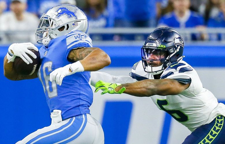 Detroit Lions running back Craig Reynolds (46) is pursued by Seattle Seahawks safety Quandre Diggs (6) during the first half of an NFL football game, Sunday, Oct. 2, 2022, in Detroit. (AP Photo/Duane Burleson) OTK0441