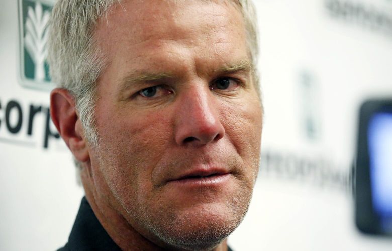 FILE – Former NFL quarterback Brett Favre speaks with reporters prior to his induction to the Mississippi Hall of Fame in Jackson, Miss., Saturday, Aug. 1, 2015. Mississippi’s largest public corruption case in state history, in which tens of millions of dollars earmarked for needy families was misspent, involves a number of sports figures with ties to the state â€” including NFL royalty Brett Favre and a famous former pro wrestler. (AP Photo/Rogelio V. Solis, File) NY163 NY163