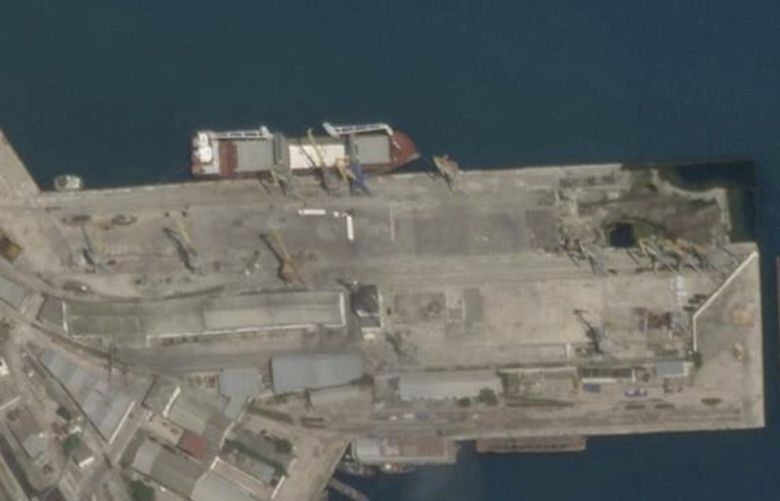 In this Planet Labs satellite image, the cargo ship Laodicea is docked at a port in Feodosia, Crimea, on July 11, 2022. Two weeks later, when it arrived at the Lebanese port city Tripoli, a manifest falsely claimed the barley and wheat flour in its hold was loaded at a small Russian port on the other side of the Black Sea. (Planet Labs via AP) NY912 NY912