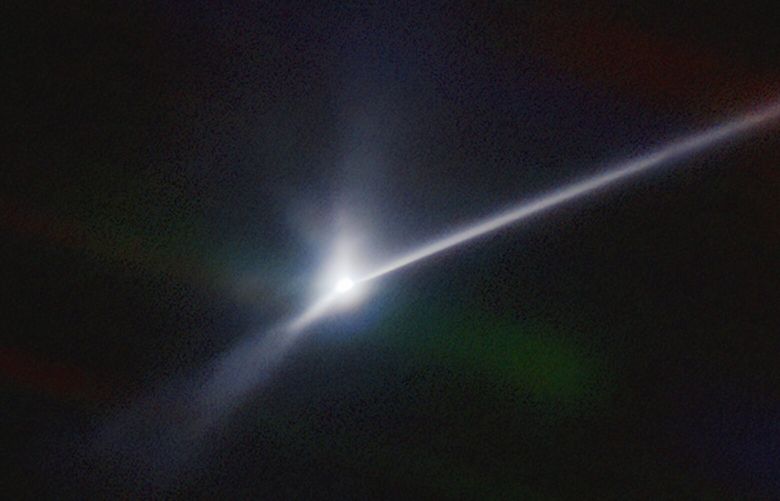 This image made available by NOIRLab shows a plume of dust and debris blasted from the surface of the asteroid Dimorphos by NASA’s DART spacecraft after it impacted on Sept. 26, 2022, captured by the U.S. National Science Foundation’s NOIRLab’s SOAR telescope in Chile. The expanding, comet-like tail is more than 6,000 miles (10,000 kilometers) long. (Teddy Kareta, Matthew Knight/NOIRLab via AP) NY981 NY981
