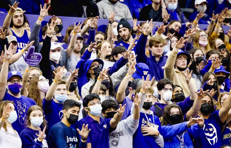 Students show up for their school during the second half of a game between University of Washington and Washington State University at Alaska Airlines Arena in Seattle on Feb. 26, 2022. 219697