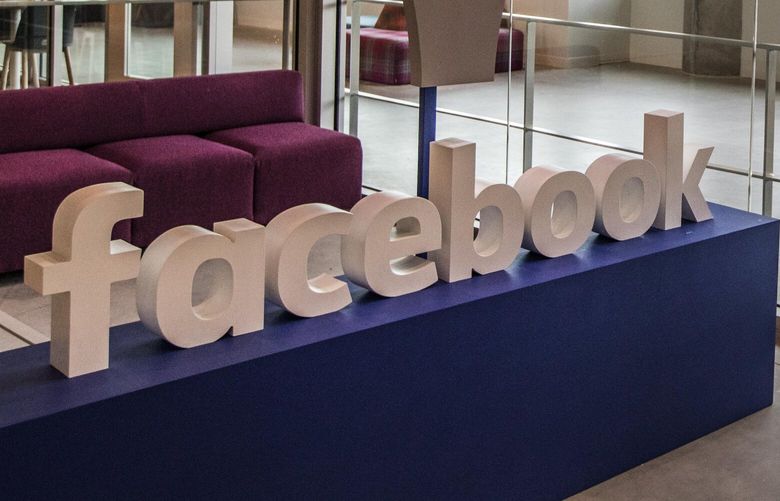 Tuesday, March 13, 2018. A Facebook employee works in one of many Lounge seating pods located throughout the new Facebook building on Westlake. 205600
