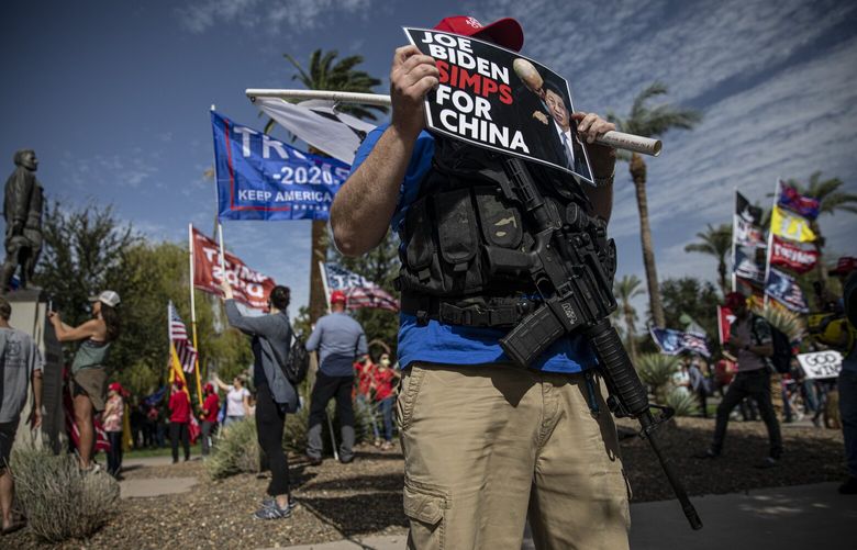 FILE – Supporters of President Donald Trump protest the result of the election at the Arizona State Capitol in Phoenix on Nov. 7, 2020. More than a century and a half after the actual Civil War, “civil war” references have become increasingly commonplace on the right. While in many cases the term is used only loosely, observers note that the phrase, for some, is far more than a metaphor. (Adriana Zehbrauskas/The New York Times)