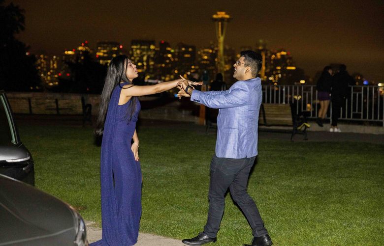 Dressed to the nines around midnight Akash Trehan dances with Gunjan Raichandani as they finish off a romantic birthday celebration night at Kerry Park on Oct. 4, 2022. The pair danced to songs playing on their car stereo like Bruno Mars’ “That’s What I like.” It was Raichandani’s 27th birthday celebration: “We both love dancing. We do dance pretty often wherever and whenever we can even though this was not planned.”