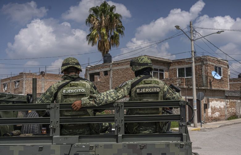 FILE — Members of the military on patrol in Celaya, Mexico, Aug. 23, 2022. Hackers infiltrated the Mexican Defense Ministry, publishing millions of emails that detail the military’s growing influence over the civilian government. (Alejandro Cegarra/The New York Times) XNYT197 XNYT197