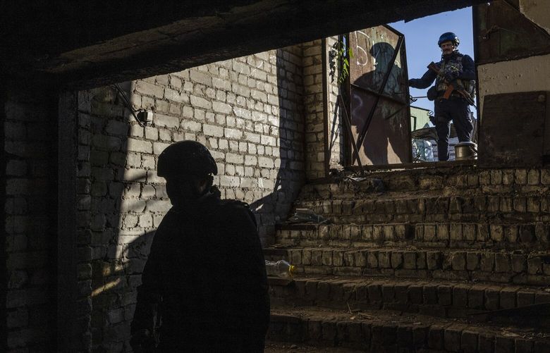 Regional police investigators survey a basement where Russian forces held and interrogated prisoners in Kozacha Lopan, a small town near the Russian border in the northern Kharkiv region of Ukraine, on Thursday, Oct. 6, 2022. Discontent among supporters of Russiaâ€™s faltering invasion of Ukraine has produced an extraordinary barrage of criticism directed at the leadership of the Russian military, creating a new challenge to President Vladimir V. Putin, who, after cracking down on Russiaâ€™s liberal opposition, now faces growing dissent in his own camp. (Ivor Prickett/The New York Times) XNYT85 XNYT85