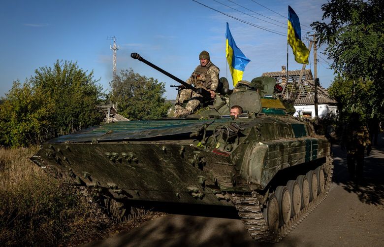 Ukrainian soldiers in a captured Russian military vehicle on Thursday, Oct. 6, 2022 in Velyka Oleksandrivka, Ukraine. Discontent among supporters of Russia’s faltering invasion of Ukraine has produced an extraordinary barrage of criticism directed at the leadership of the Russian military, creating a new challenge to President Vladimir Putin. (Nicole Tung/The New York Times) XNYT142 XNYT142