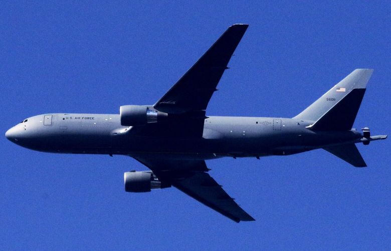 A Boeing KC-46 tanker flies over Seattle on March 19, 2020.  The U.S. Air Force tanker is a reconfigured Boeing 767 jetliner.  It’s to replace the KC-135 Stratotanker.

 213455