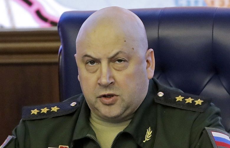 FILE – Colonel General Sergei Surovikin, Commander of the Russian forces in Syria, speaks, with a map of Syria projected on the screen in the back, at a briefing in the Russian Defense Ministry in Moscow, Russia, Friday, June 9, 2017. Russia’s Defense Ministry announced that air force chief, Gen. Sergei Surovikin, would be the commander of all Russian troops fighting in Ukraine. The statement marked the first official appointment of a single commander for the entire Russian force in Ukraine. (AP Photo/Pavel Golovkin, File) XAZ111 XAZ111