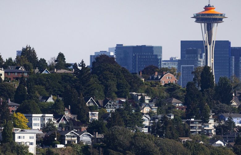 The Space Needle and downtown loom in the background of Queen Anne homes, seen from Magnolia, Wednesday, Sept. 21, 2022 in Seattle. Seattle is the fastest cooling market in the nation according to new numbers from Redfin.Queen Anne homes are seen from Magnolia, Wednesday, Sept. 21, 2022 in Seattle.
Seattle is the fastest cooling market in the nation according to new numbers from Redfin.