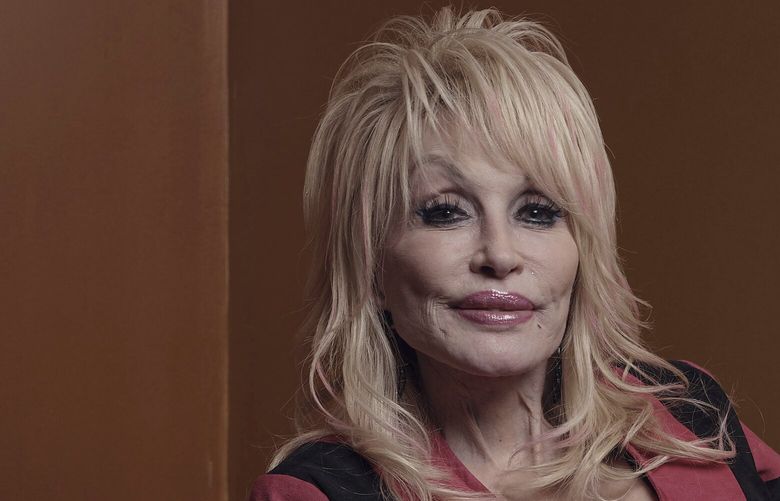 Dolly Parton poses for a picture before the Carnegie Medal of Philanthropy Ceremony at Gotham Hall on Thursday, Oct. 13, 2022, in New York. Parton laughs at the idea that she is some sort of secret philanthropist. â€œI donâ€™t do it for attention,â€ she told The Associated Press in an interview, shortly before she received the Carnegie Medal of Philanthropy at Gotham Hall in New York City Thursday night. (AP Photo/Andres Kudacki) NYAK118 NYAK118