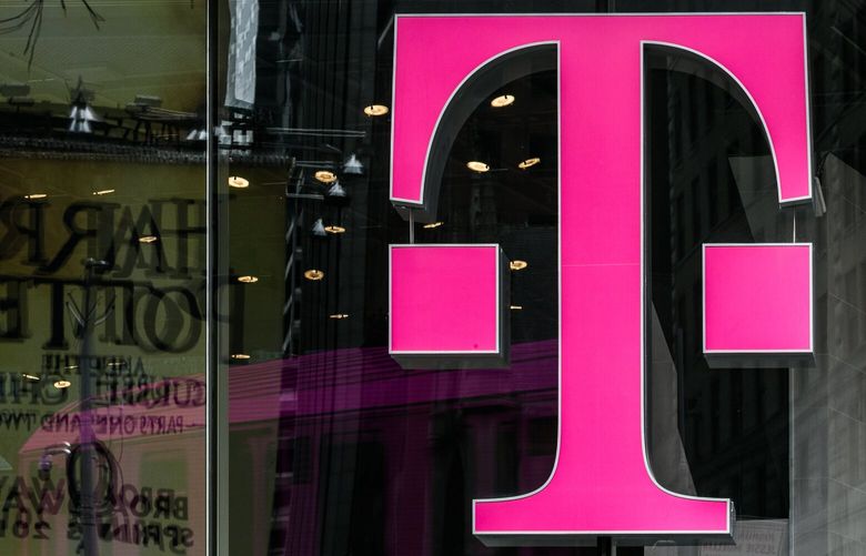 A T-Mobile US Inc. logo is displayed on a store location in New York (Jeenah Moon/Bloomberg )