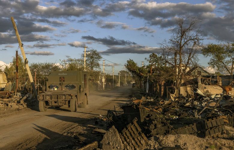 FILE – Ukrainian troops move through Yatskivka, a recently recaptured village in eastern Ukraine, on Oct. 4, 2022. Russia hopes that the threat of troops from Belarus will force Ukraine to divert its troops from front lines in the east and south. (Ivor Prickett/The New York Times)