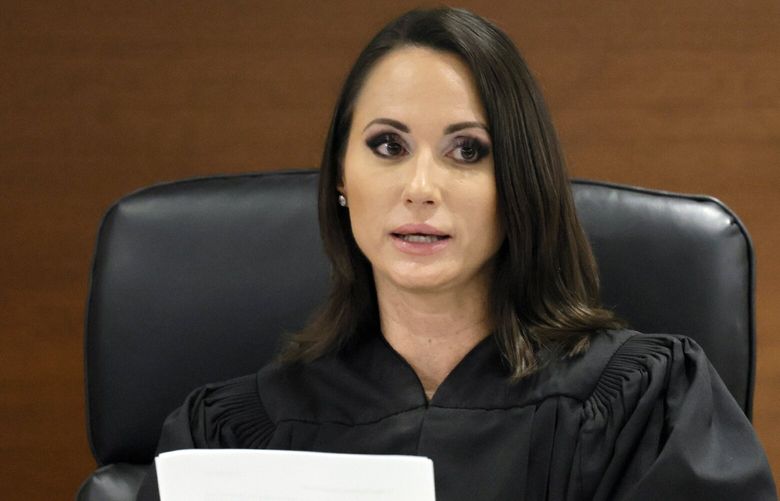 Judge Elizabeth Scherer reads the verdict in the trial of Marjory Stoneman Douglas High School shooter Nikolas Cruz at the Broward County Courthouse in Fort Lauderdale on Thursday, Oct. 13, 2022. A jury spared Cruz from the death penalty Thursday for killing 17 people at a Parkland high school in 2018, sending him to prison for the remainder of his life. (Amy Beth Bennett/South Florida Sun-Sentinel via AP, Pool) FLLAU507 FLLAU507