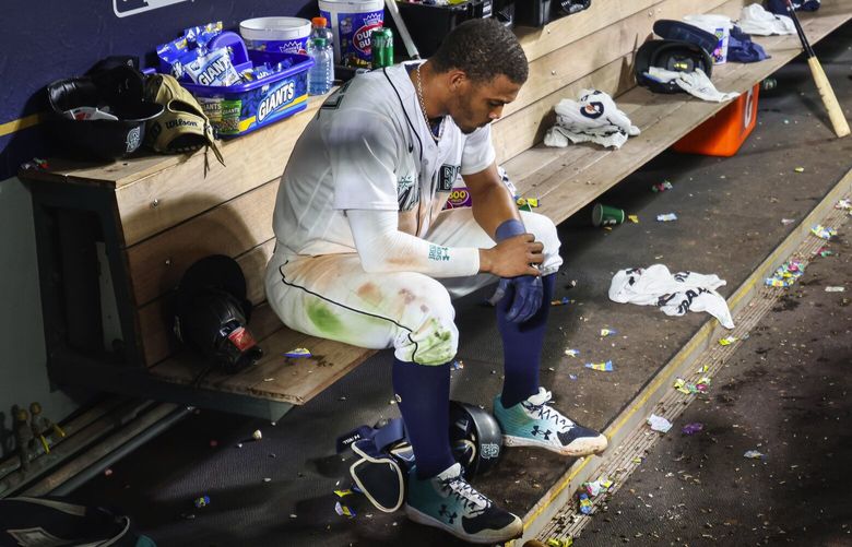 Julio Rodriguez sits in the Mariners dugout after registering the final out in Houston’s 1-0 win in Game 3 of the ALDS. 221867 221867