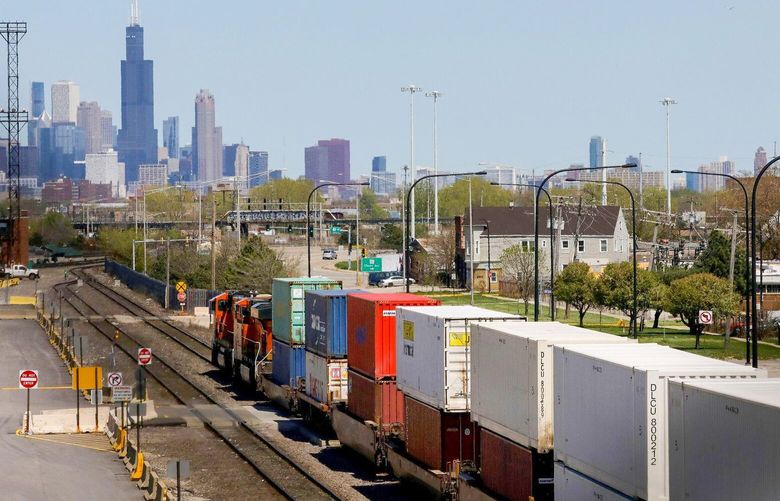 A freight train hauling containers heads toward Chicago, at the busy rail intermodal BNSF yard in Cicero on May 6, 2020. 1662122