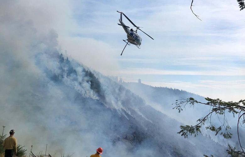 Crews work on putting out the Nakia Creek Fire last week.