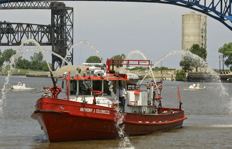 FILE – The Cleveland Fire Department fire boat sprays water on the Cuyahoga River in Cleveland Monday, June 22, 2009, on the anniversary of when floating oil and debris caught fire on the river helping spur the environmental movement and the federal Clean Water Act. Fifty years ago, Congress passed the Clean Water Act to protect U.S. waterways from abuses like the oily industrial pollution that caused Ohio’s Cuyahoga River to catch on fire in 1969. (AP Photo/Mark Duncan, File) CLI603 CLI603
