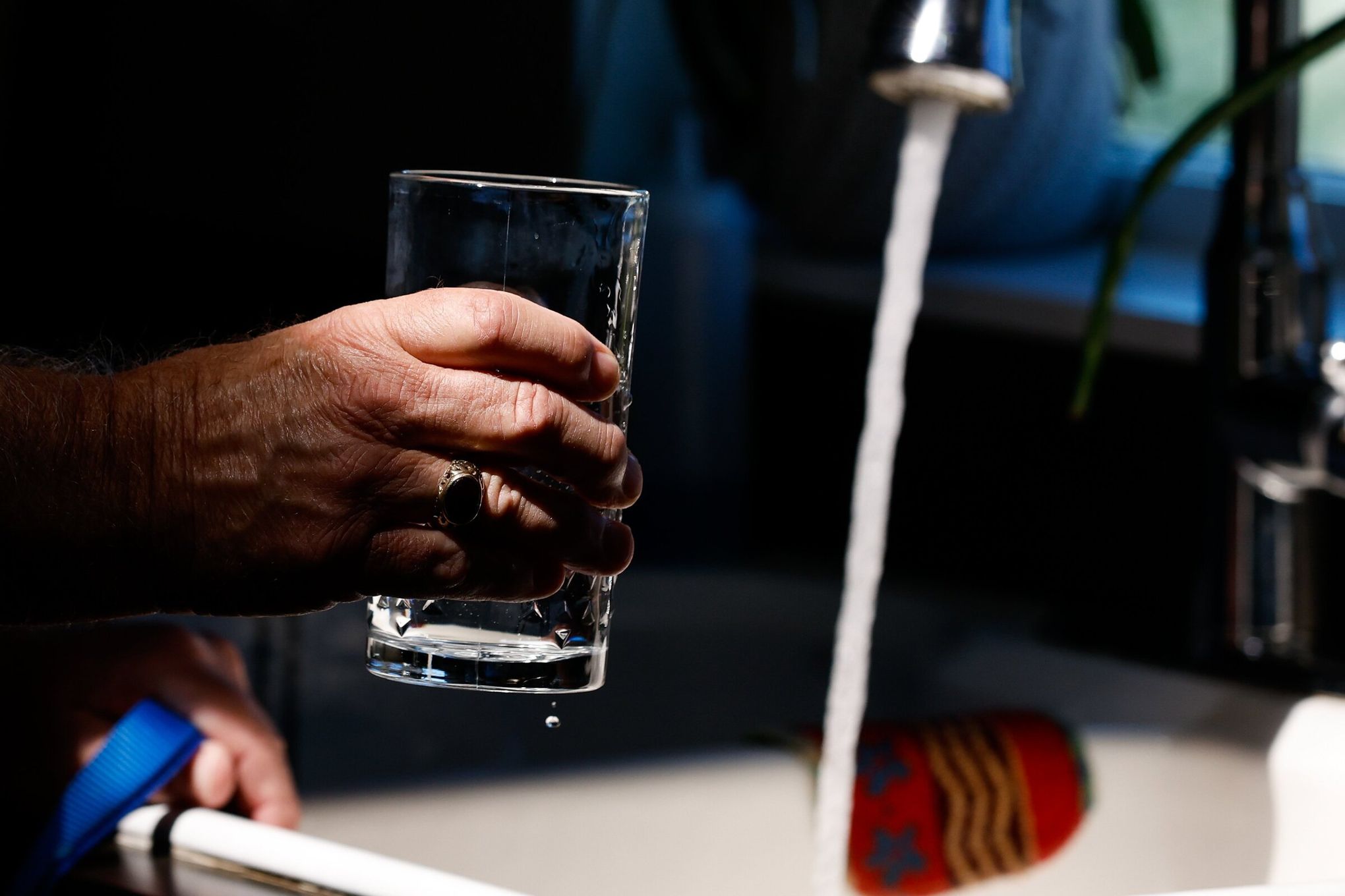 Woman drinking water from bottle and pours water on her breasts and  stomach. Thirsty Girl in