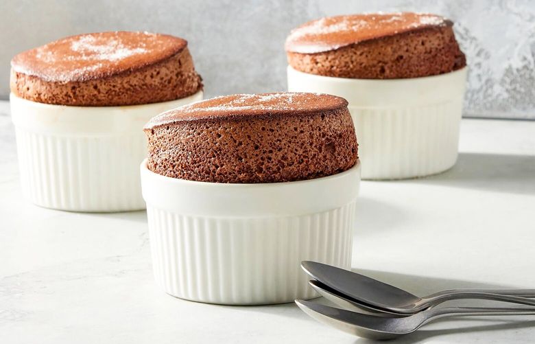 Chocolate soufflés, in New York on Oct. 3, 2022. Delicate and sensitive soufflés are absolutely worth the effort. Food styled by Simon Andrews.