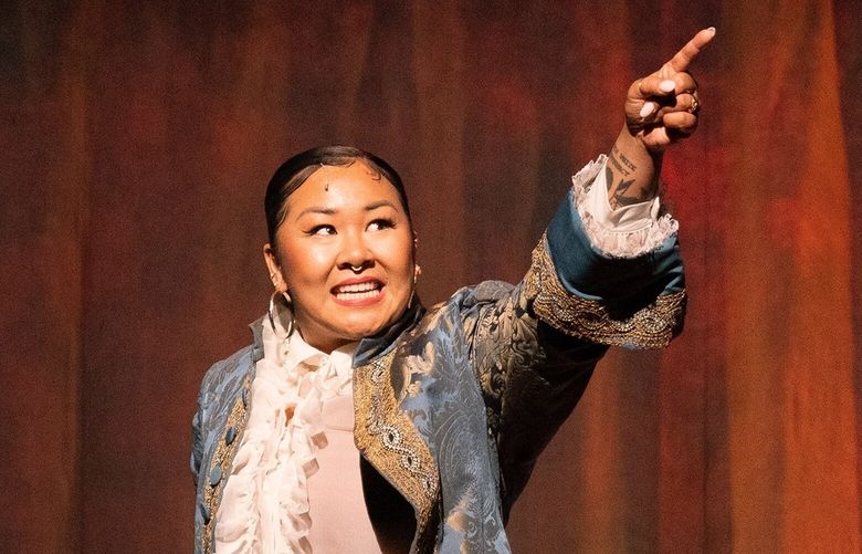 Sara Porkalob, center, as the pro-slavery Edward Rutledge in “1776,” in which the performers identify as female, transgender and nonbinary, at the American Airlines Theater in New York, Sept. 15, 2022. The Broadway revival of the musical about the Declaration of Independence underlines the gender imbalance among the Founding Fathers, and everything else, writes Jesse Green, the chief theater critic for The New York Times. (Sara Krulwich/The New York Times) XNYT180 XNYT180