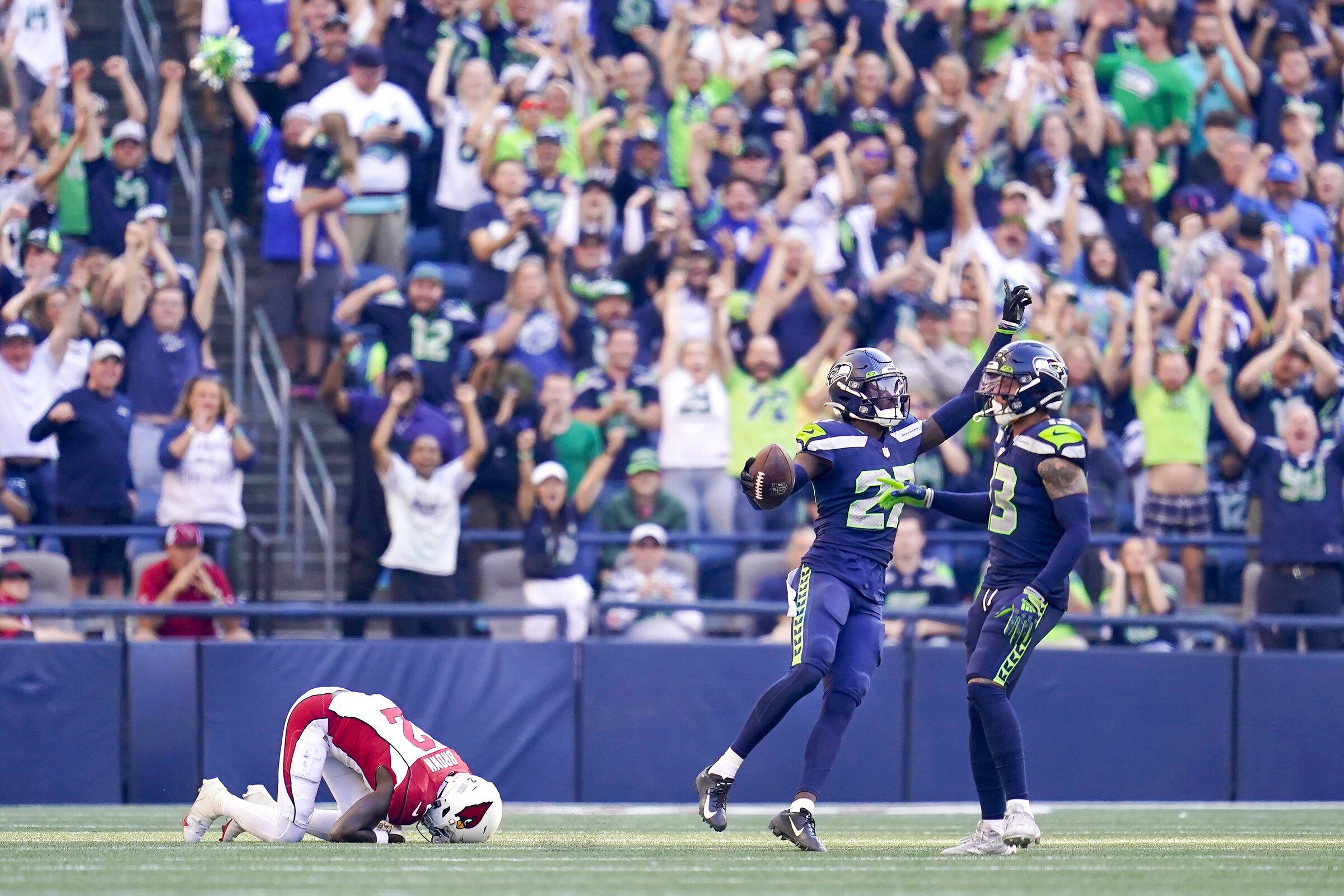 Seattle Seahawks safety Ryan Neal (26) celebrates after a play during the  first half of an NFL football game against the Los Angeles Chargers Sunday,  Oct. 23, 2022, in Inglewood, Calif. (AP