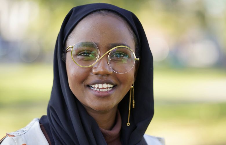 Mana Abdi, 26, a Democratic candidate for state legislature, speaks with a reporter, Thursday, Oct. 6, 2022, in Lewiston, Maine. She is running unopposed. Her Republican opponent, who had posted on Facebook that Muslims “should not be allowed to hold public office,” withdrew from the race in August. (AP Photo/Robert F. Bukaty) MERB201 MERB201