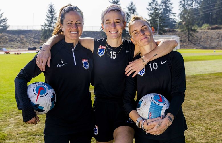Lauren Barnes, Megan Rapinoe and Jess Fishlock are photographed at a field at the Bellarmine Preparatory School after a practice on Oct. 18, 2022.