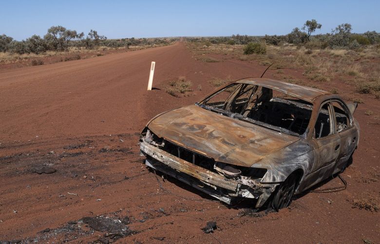 ALONG THE OUTBACK WAY AUSTRALIA – AUGUST 23 A destroyed vehicle is seen on August 23, 2022 along the Outback Way, Australia. Abandoned and wrecked cars are a frequent sight along the entire route. Many people leave the vehicles because of the exorbitant costs involved in getting a vehicle towed in the remote region. Accidents due to poor highway conditions and often, wildlife and livestock that has wandered onto the road are common. MUST CREDIT: Washington Post photo by Michael Robinson Chavez.