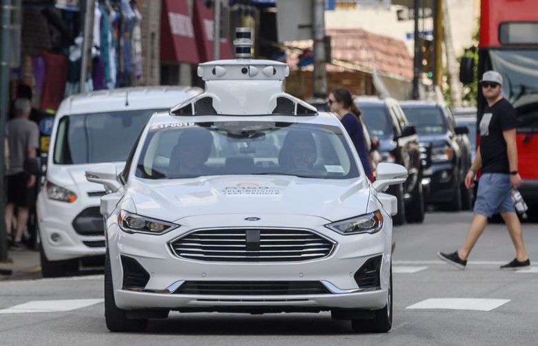 An Argo AI self-driving vehicle drives in Pittsburgh, July 12, 2019. Ford and other companies say the industry overestimated the arrival of autonomous vehicles, which still struggle to anticipate what other drivers and pedestrians will do. (Jeff Swensen/The New York Times) XNYT40