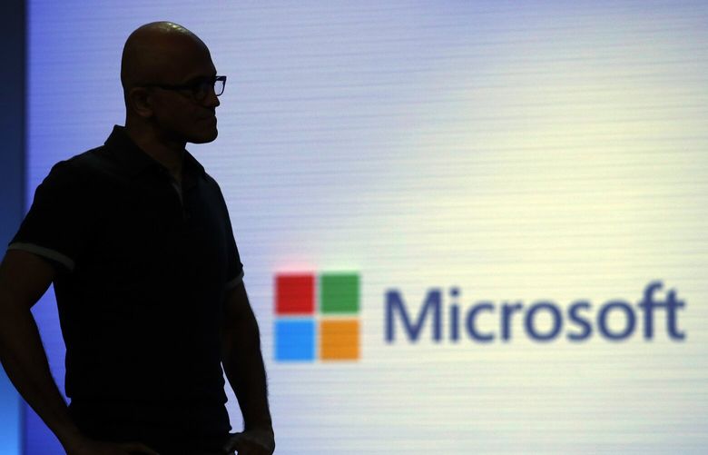 FILE- In this May 7, 2018, file photo Microsoft CEO Satya Nadella looks on during a video as he delivers the keynote address at Build, the company’s annual conference for software developers in Seattle.  (AP Photo/Elaine Thompson, File) 
