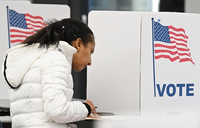 A voter fills out a ballot at George C. Marshall High School on Nov. 2, 2021, in Falls Church, Va. MUST CREDIT: Washington Post photo by Matt McClain