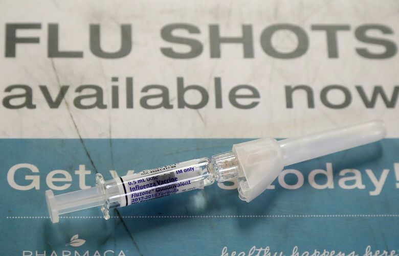 A Fluzone influenza vaccine is shown at Pharmaca Integrative Pharmacy in San Francisco, Tuesday, Jan. 9, 2018. Flu-related deaths in California are higher than usual so far this season and most victims were not vaccinated, state health officials said Tuesday in urging residents to get flu shots. (AP Photo/Jeff Chiu) CAJC102