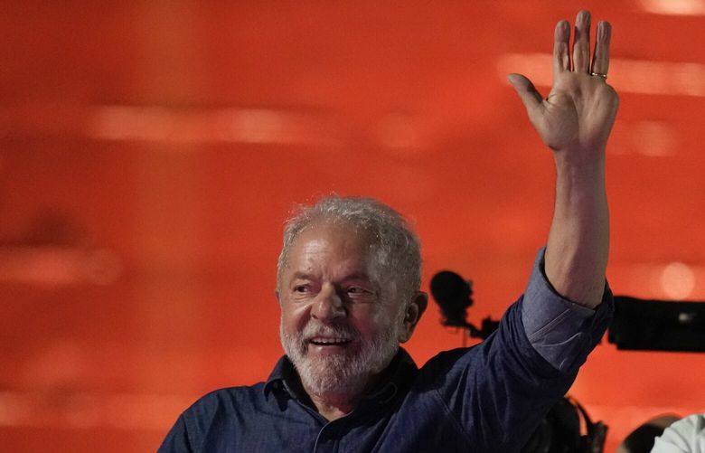Former Brazilian President Luiz Inacio Lula waves to supporters gathered on Paulista Av. after he defeated incumbent Jair Bolsonaro in a presidential run-off election to become the country’s next president, in Sao Paulo, Brazil, Sunday, Oct. 30, 2022. At right is running mate Geraldo Alckmin. (AP Photo/Andre Penner) XRM160 XRM160