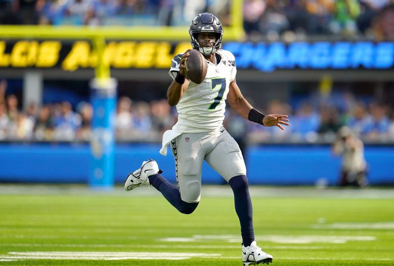 Seattle Seahawks quarterback Geno Smith (7) runs the ball during the first half of an NFL football game against the Los Angeles Chargers Sunday, Oct. 23, 2022, in Inglewood, Calif. (Marcio Jose Sanchez / The Associated Press)