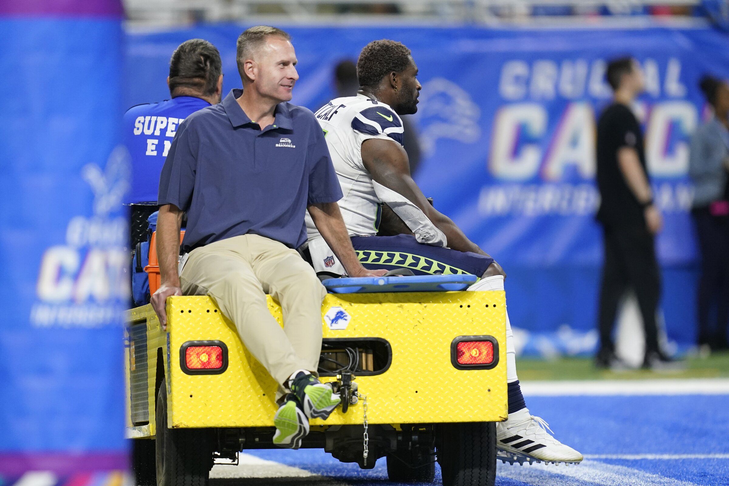 DK Metcalf's injury-cart ride because of 'tummy ache' and locker