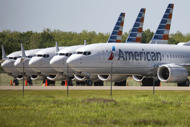 American Airlines 737 MAX airplanes sit parked outside a maintenance hangar at Tulsa International Airport in Oklahoma during the grounding of the MAX in 2019. (Patrick T. Fallon / Bloomberg)