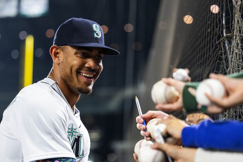 American League's Julio Rodriguez, of the Seattle Mariners, smiles