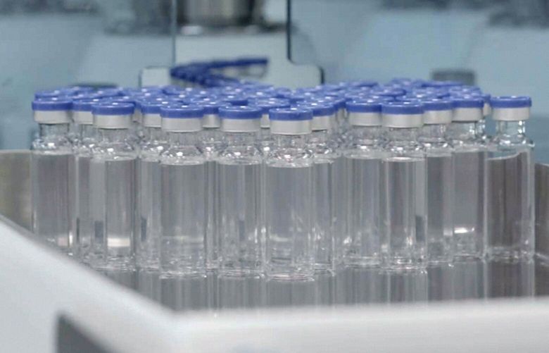 FILE – In this image provided by the Serum Institute of India, vials of freshly manufactured Novavax COVID-19 vaccines wait to be labeled in 2022, in Pune, India. On Wednesday, Oct. 19, 2022, U.S. regulators authorized a booster dose of the COVID-19 vaccine made by Novavax. (Serum Institute of India for Novavax via AP) NY456 NY456