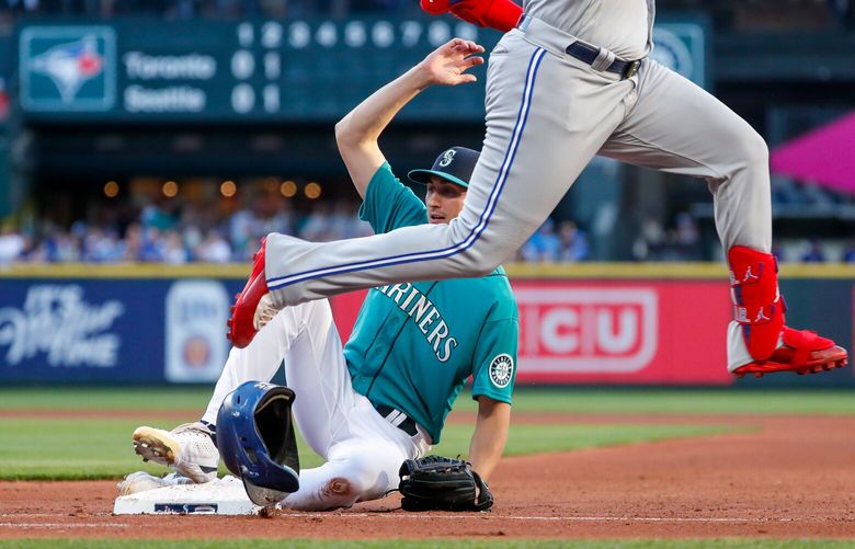 T-Mobile Park – Seattle Mariners vs. Toronto Blue Jays – 070822

Seattle Mariners starting pitcher George Kirby slides into first base for the tag out on Toronto Blue Jays designated hitter Vladimir Guerrero Jr. during the third inning, Friday, July 8, 2022, in Seattle, Wash. 220923