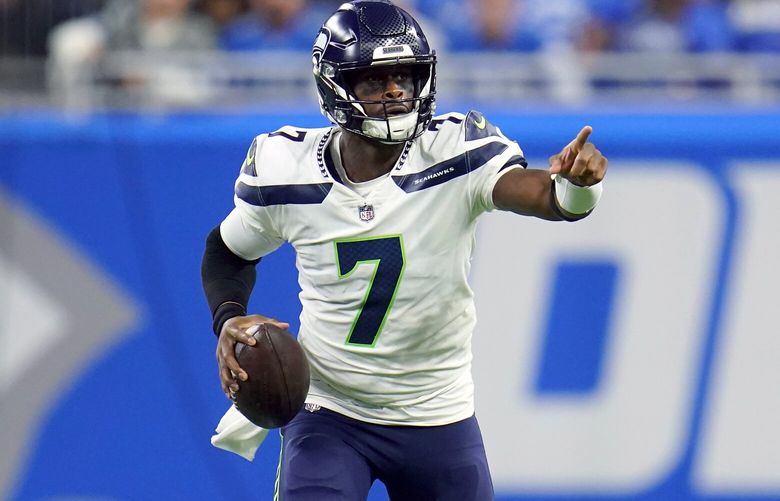 Seattle Seahawks quarterback Geno Smith scrambles during the first half of an NFL football game against the Detroit Lions, Sunday, Oct. 2, 2022, in Detroit. (AP Photo/Paul Sancya) otkco115 otkco115
