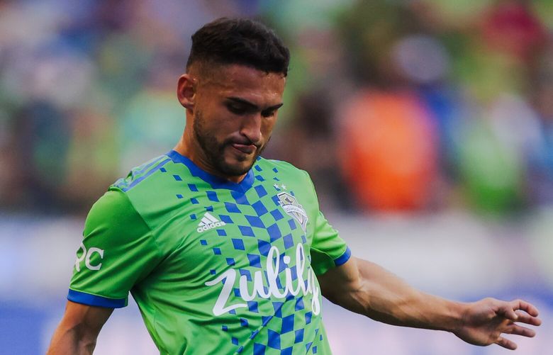 Seattle Sounders FC Midfielder Cristian Roldan goes for a kick during the first half of a game against Real Salt Lake in Seattle, WA on August 14, 2022.